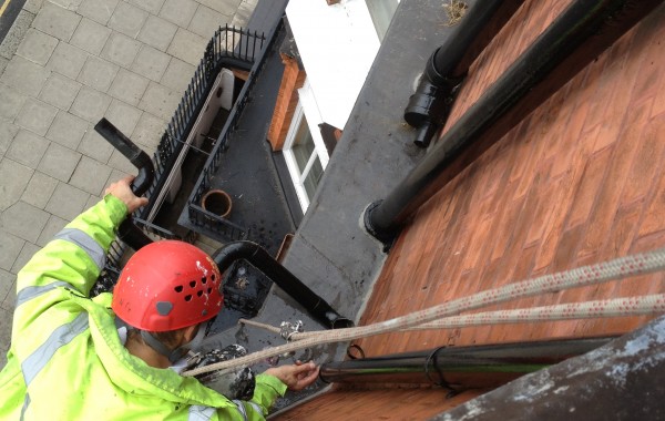 Clearing and repairing a blocked down pipe – London