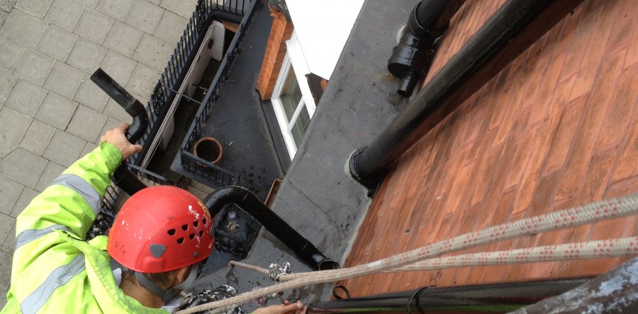 Clearing and repairing a blocked down pipe – London